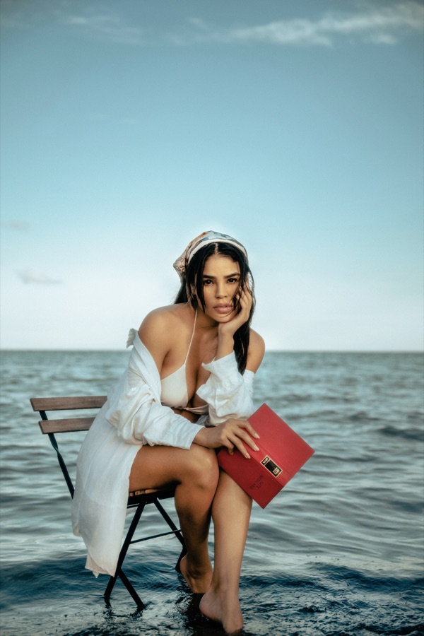 Editorial portrait seated in the sea