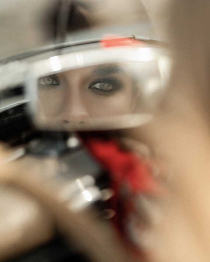 Portrait through a rear-view mirror